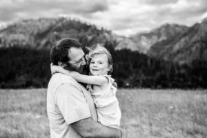 Black and white image of dad and daughter in the columbia river gorge. 
