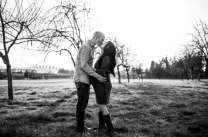 Black and white image of parents kissing at Fort Vancouver near Portland, Oregon. 