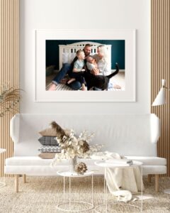Large matted framed print on the wall of Portland oregon family with a newborn. 