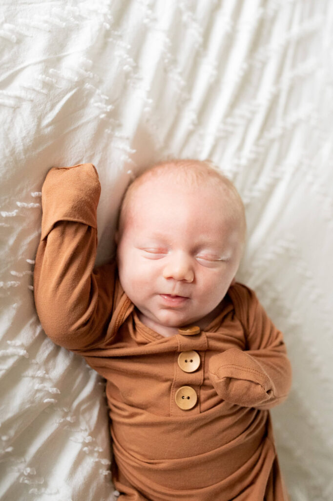 baby boy sleeping on white bedspread | Portland Midwifery 