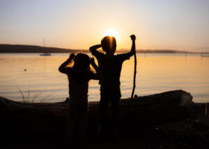 Kids silhouette in sunet on Orcas Island 