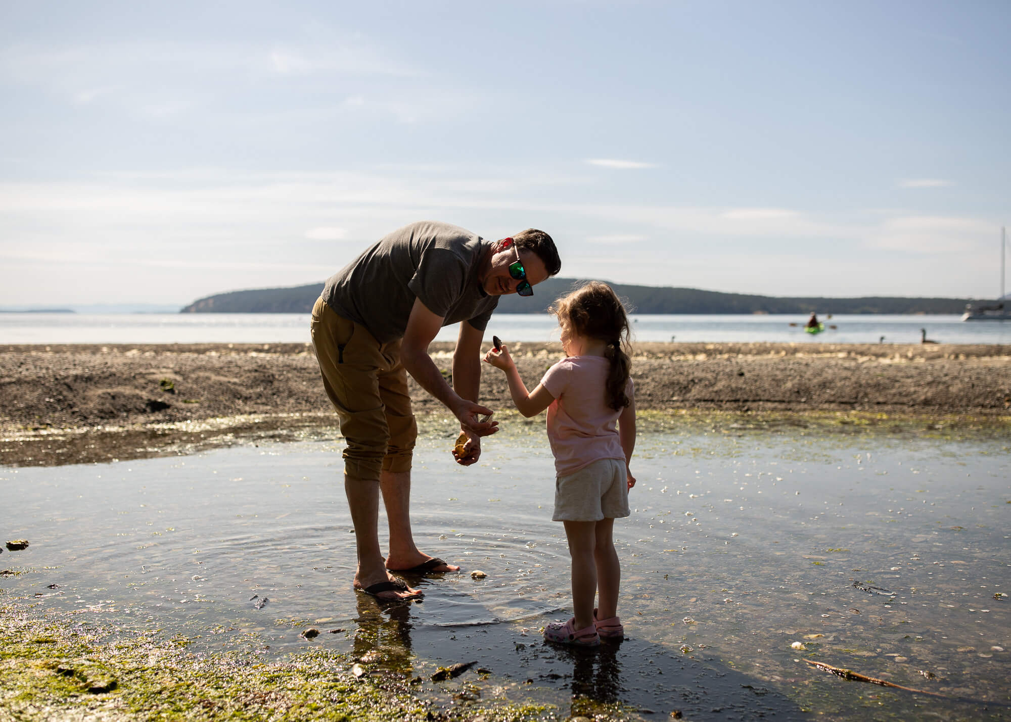 Things to do on Orcas Island with family. Father and daughter in the tide pool at West Beach Resort.