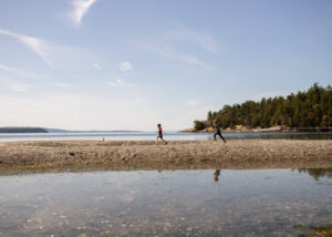 Things to do on Orcas Island | two boys running on the beach at West Beach Resort 