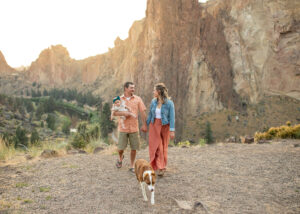 Smith Rock family photo location. Family of three with dog at sunset in the park. 