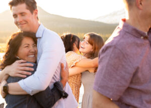 Family members hug during an evening family photo shoot in Bend, Oregon. Things To Do in Sunriver, Oregon, in Summer