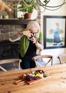 Spabettie photographs her charcuterie board in a country cottage dining room. 