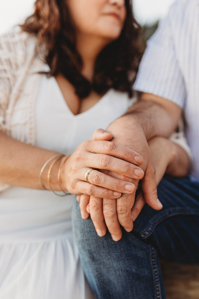 Close-up of parents enjoying quiet moments on an Oregon Coast vacation.