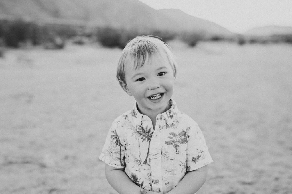 Smiling young child during a candid family photo session.